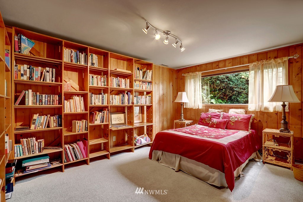 1031 C Avenue South Edmonds, WA 98020 - Photo 19 of 25 a bedroom with a large bed and a book shelf