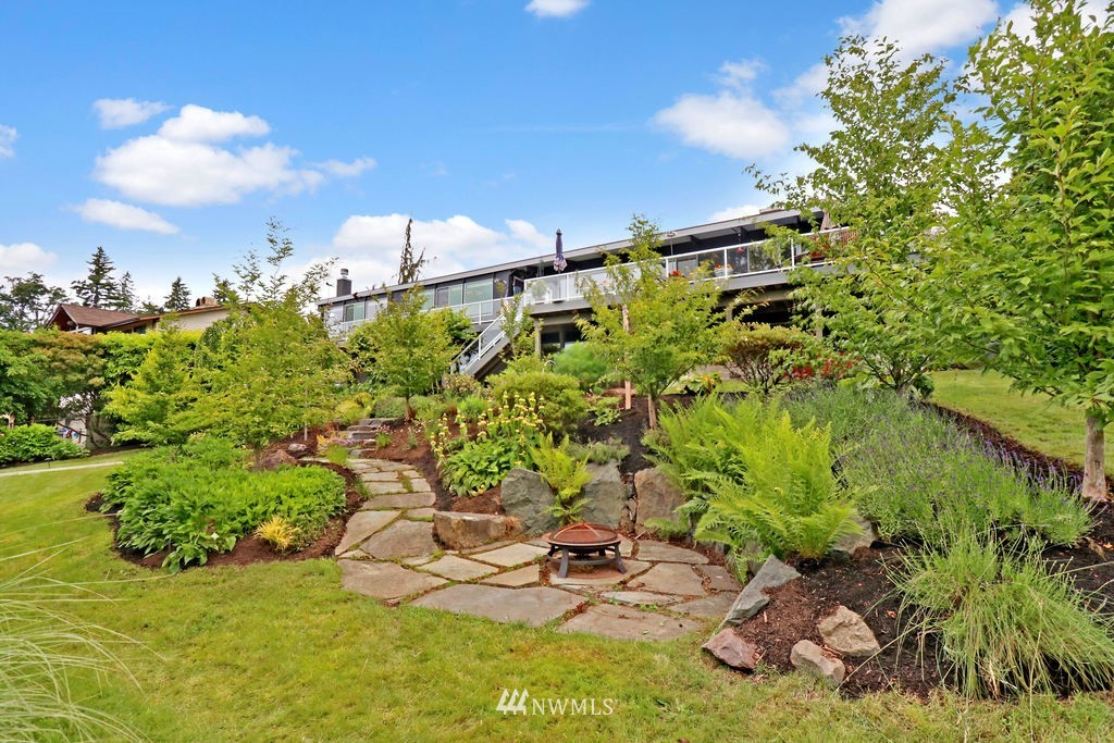 1031 C Avenue South Edmonds, WA 98020 - Photo 3 of 25 a backyard of a house with lots of green space and garden