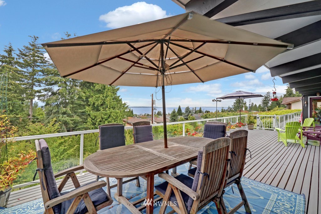 1031 C Avenue South Edmonds, WA 98020 - Photo 23 of 25 a view of a patio with a table chairs and a umbrella