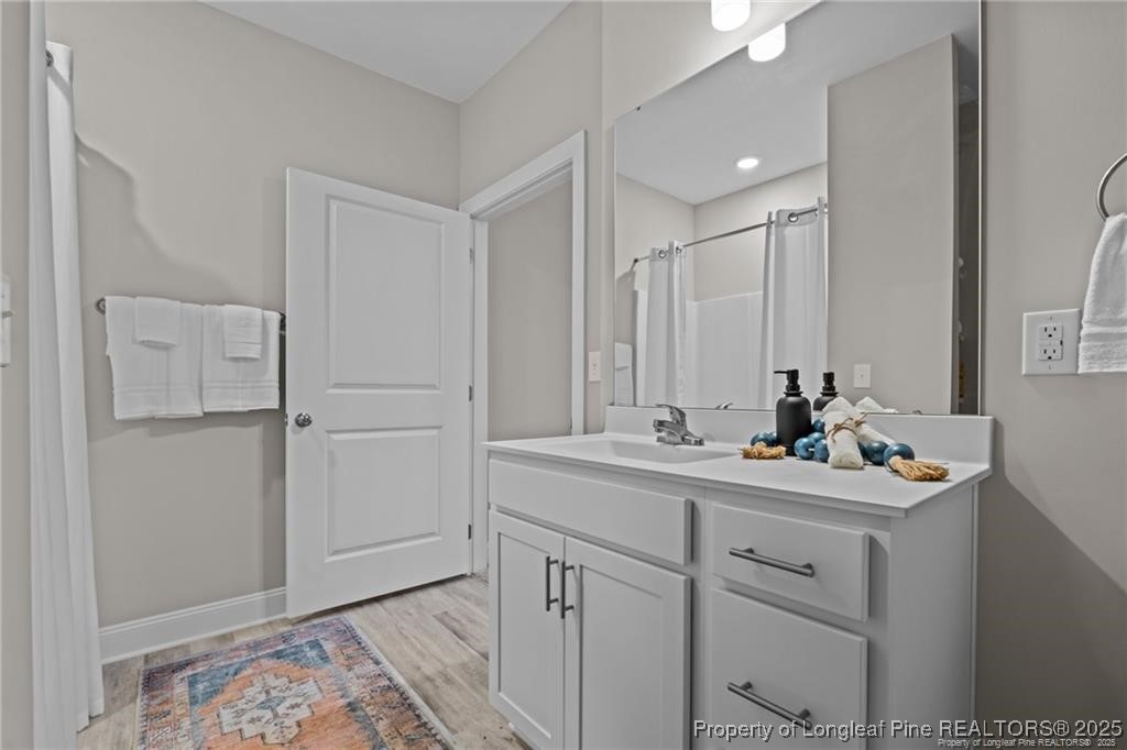 200 Gallery Drive, Unit 301 Spring Lake, NC 28390 - Photo 14 of 21 a bathroom with a sink and a mirror