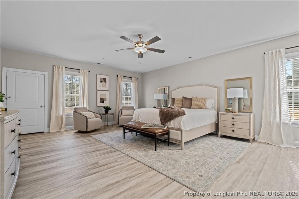200 Gallery Drive, Unit 301 Spring Lake, NC 28390 - Photo 16 of 21 a spacious bedroom with a bed couch and a window