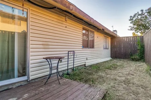 a view of a chair and tables in the balcony