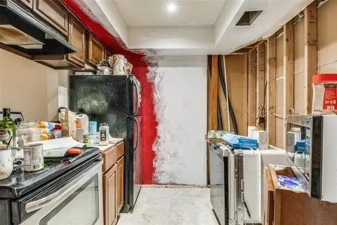 a kitchen with stainless steel appliances a sink and a stove