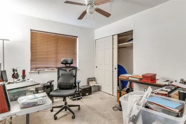 a work room with furniture and windows