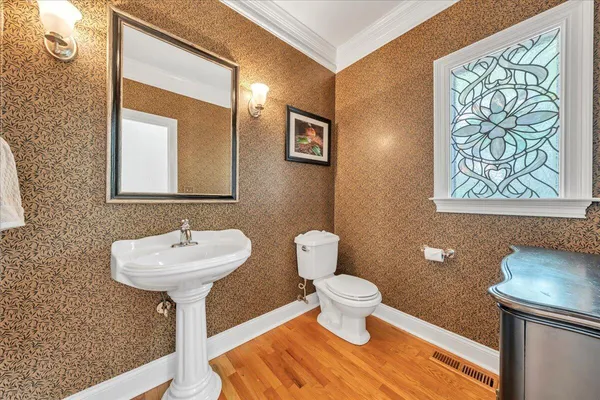 a living room with a fireplace and a chandelier