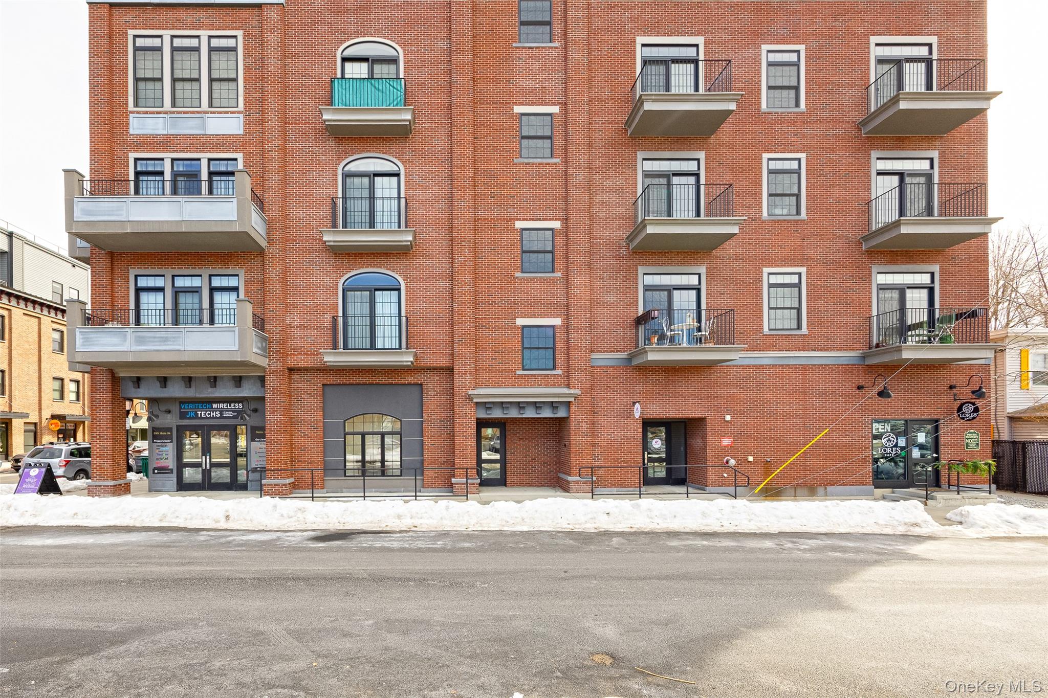 249 Main Street, Unit 312 Beacon, NY 12508 - Photo 20 of 23 a front view of a building with a street