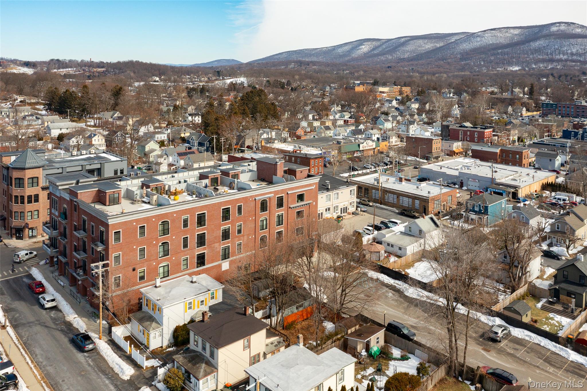 249 Main Street, Unit 312 Beacon, NY 12508 - Photo 2 of 23 an aerial view of residential houses and city view