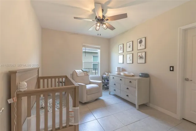 a bedroom with furniture and window