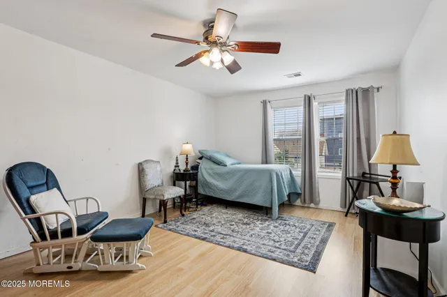 a bathroom with a sink mirror vanity and toilet