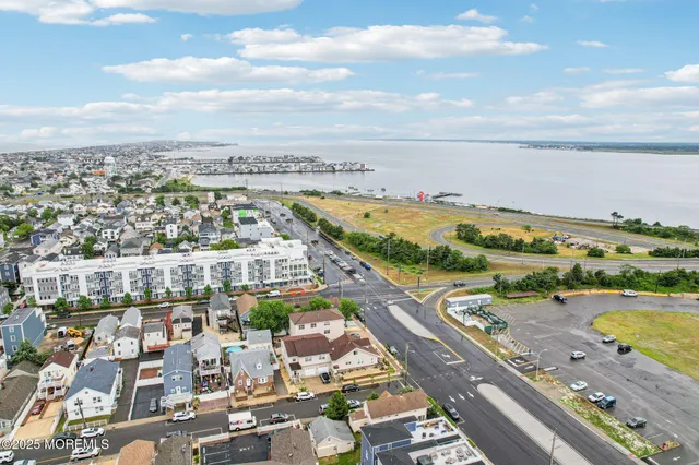 an aerial view of residential building with ocean view
