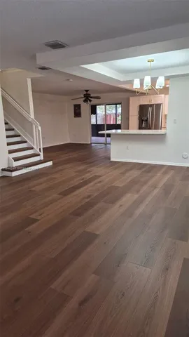 a view of a living room and entryway
