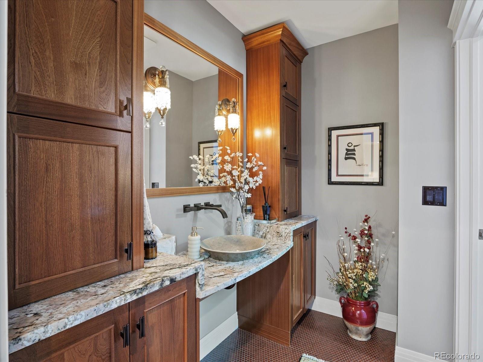718 North Locust Street Denver, CO 80220 - Photo 15 of 46 a bathroom with a granite countertop sink a large mirror and a shower