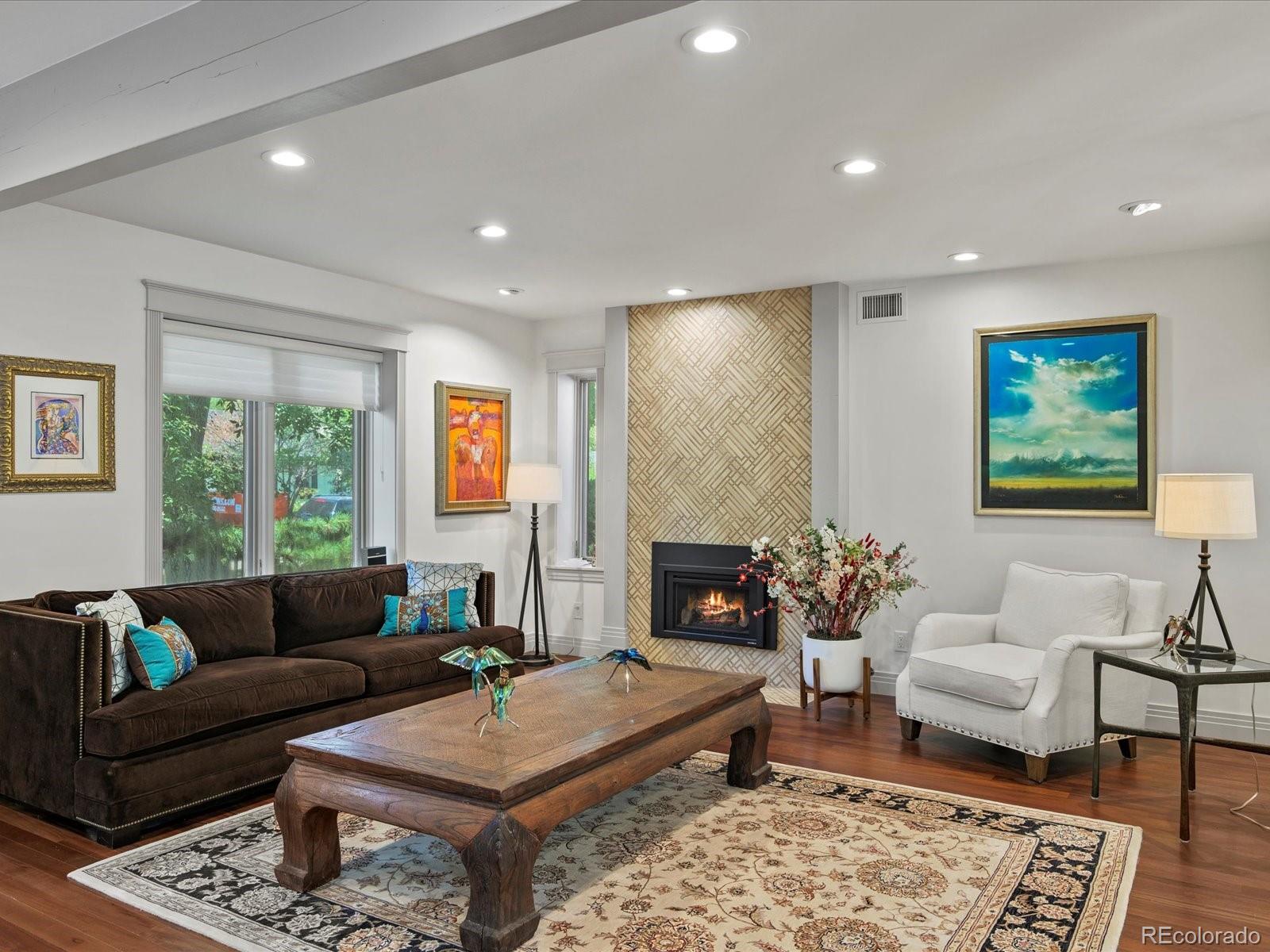 718 North Locust Street Denver, CO 80220 - Photo 2 of 46 a living room with furniture and a fireplace