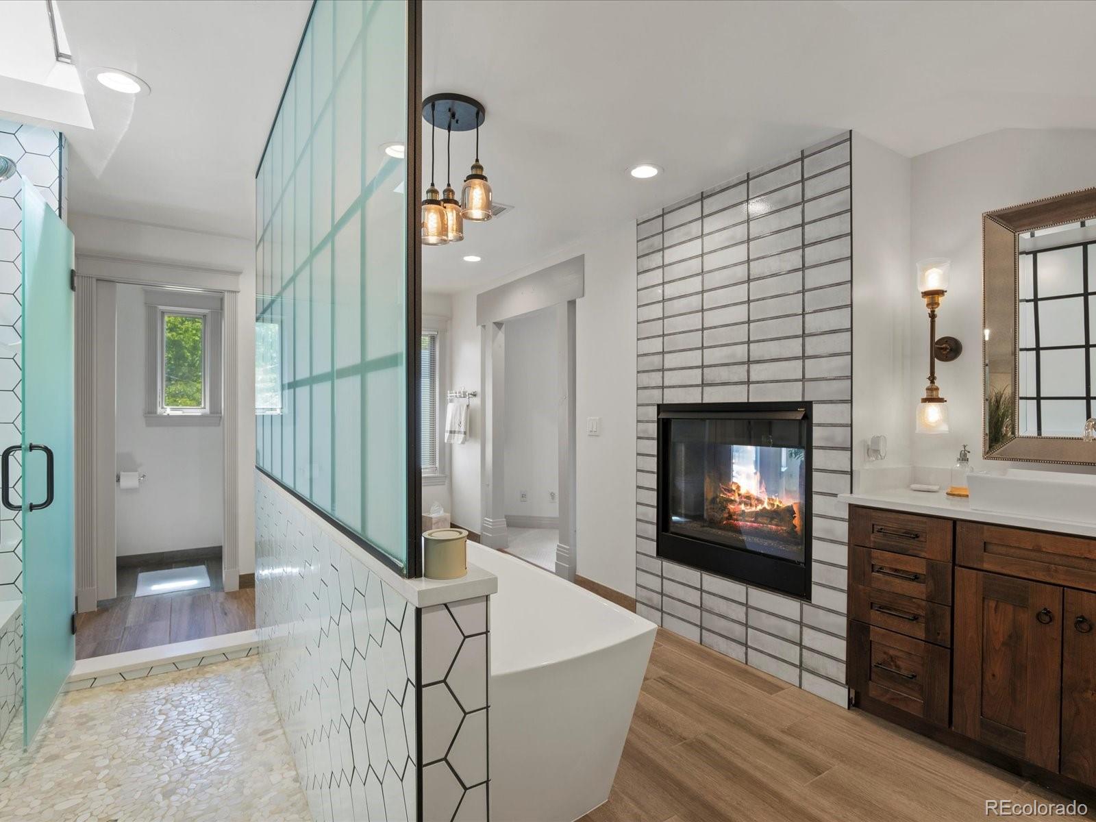 718 North Locust Street Denver, CO 80220 - Photo 24 of 46 a living room with furniture and a fireplace