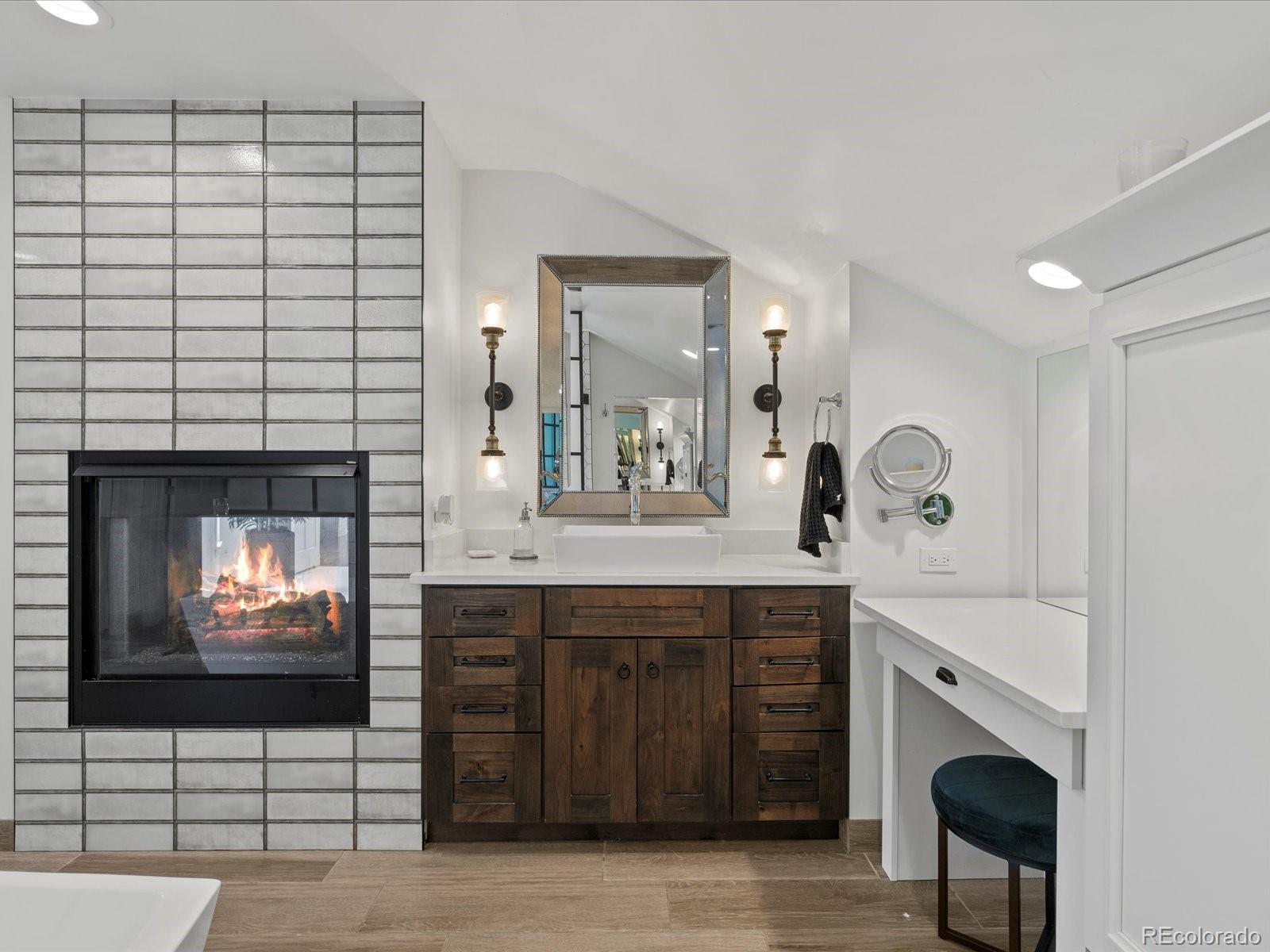 718 North Locust Street Denver, CO 80220 - Photo 25 of 46 a spacious bathroom with a sink a large mirror and a bathtub