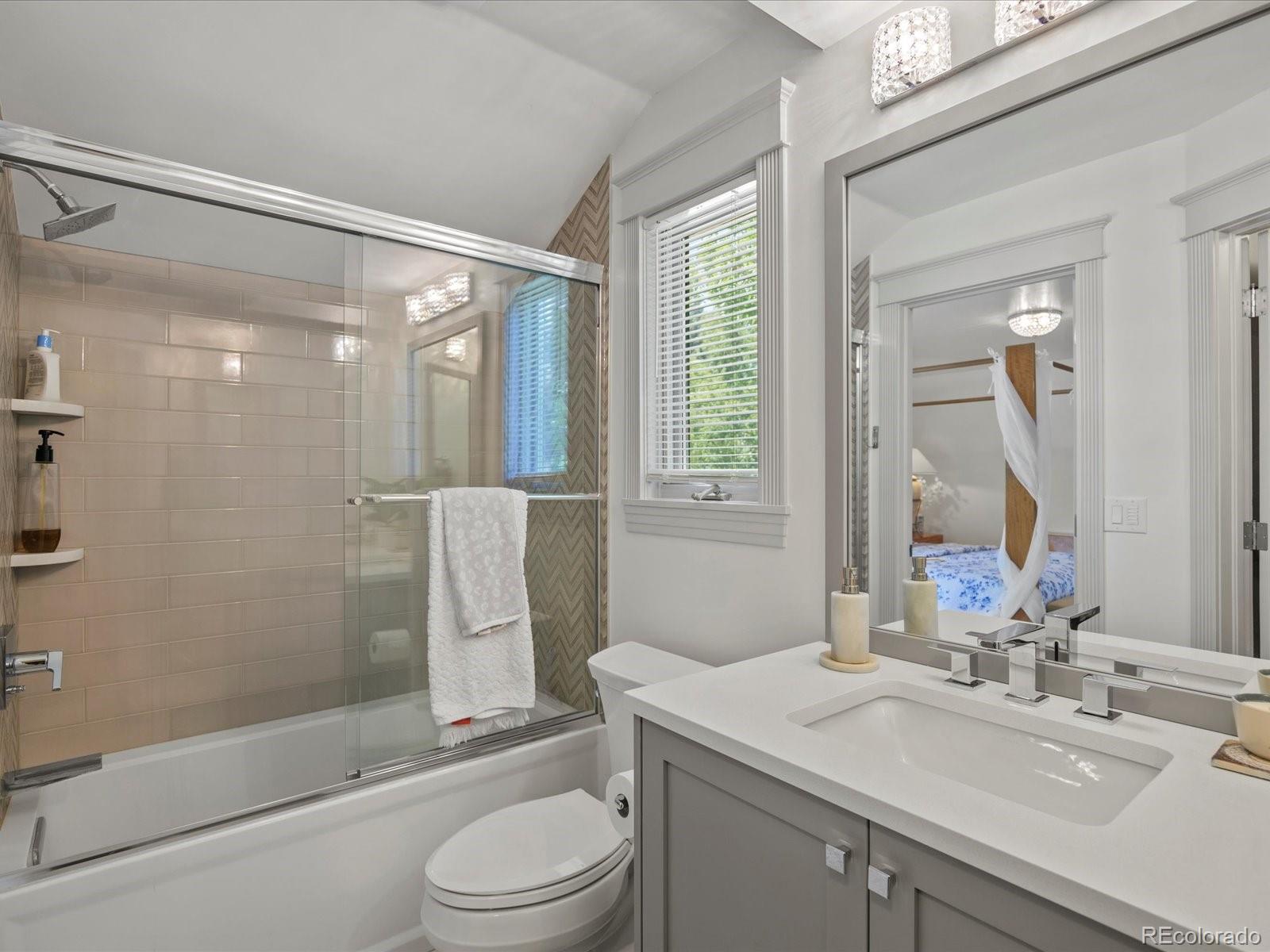 718 North Locust Street Denver, CO 80220 - Photo 29 of 46 a bathroom with a sink toilet and shower