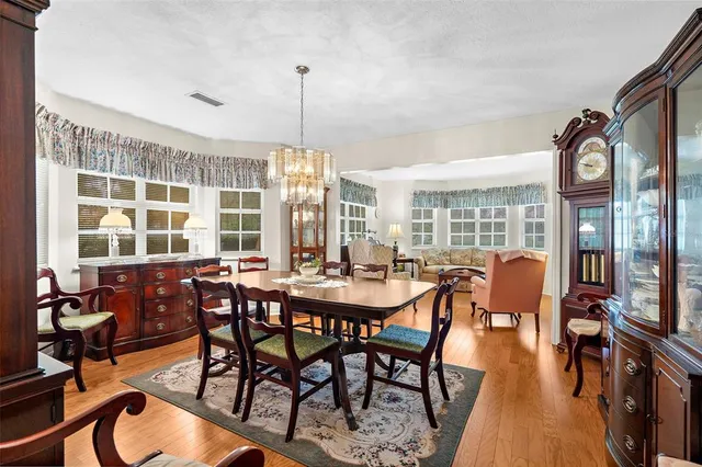 a view of a dining room with furniture window and outside view