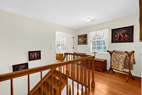 a view of a livingroom with furniture and hardwood floor