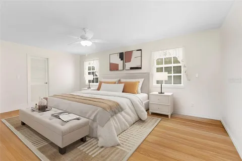 a bedroom with a bed and a couch