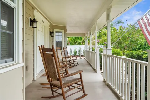 a view of two chairs in the balcony