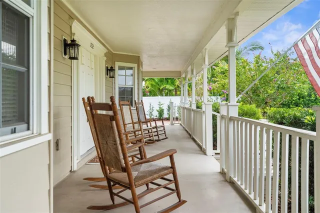 a view of two chairs in the balcony