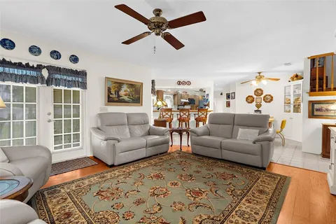 a living room with furniture and a rug