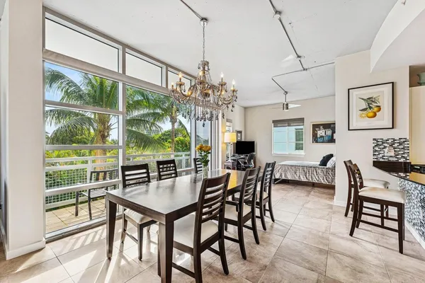 a view of a dining room with furniture window and outside view