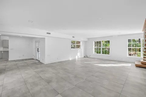a kitchen with stainless steel appliances granite countertop a stove and a sink
