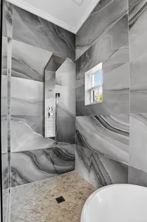 a view of a house with backyard porch and sitting area