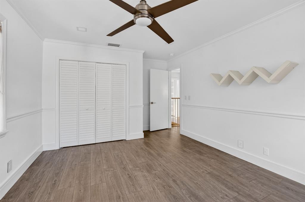 8233 Stagecoach Lane Boca Raton, FL 33496 - Photo 56 of 88 an empty room with wooden floor and windows