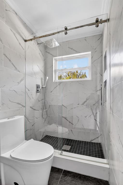 8233 Stagecoach Lane Boca Raton, FL 33496 - Photo 64 of 88 a bathroom with a toilet and a shower