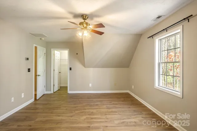 a bathroom with a sink vanity mirror and toilet