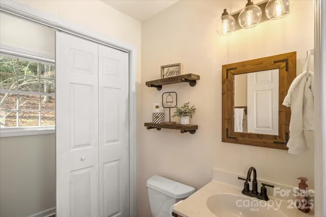 a bathroom with a toilet and shower