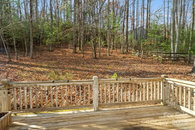 a view of a balcony with wooden floor