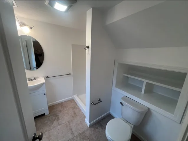 a bathroom with a toilet and a sink