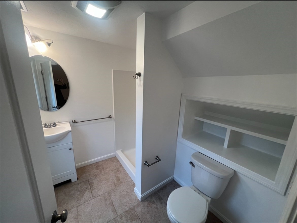 265 Dunstable Road, Unit 1 Tyngsborough, MA 01879 - Photo 5 of 6 a bathroom with a toilet and a sink