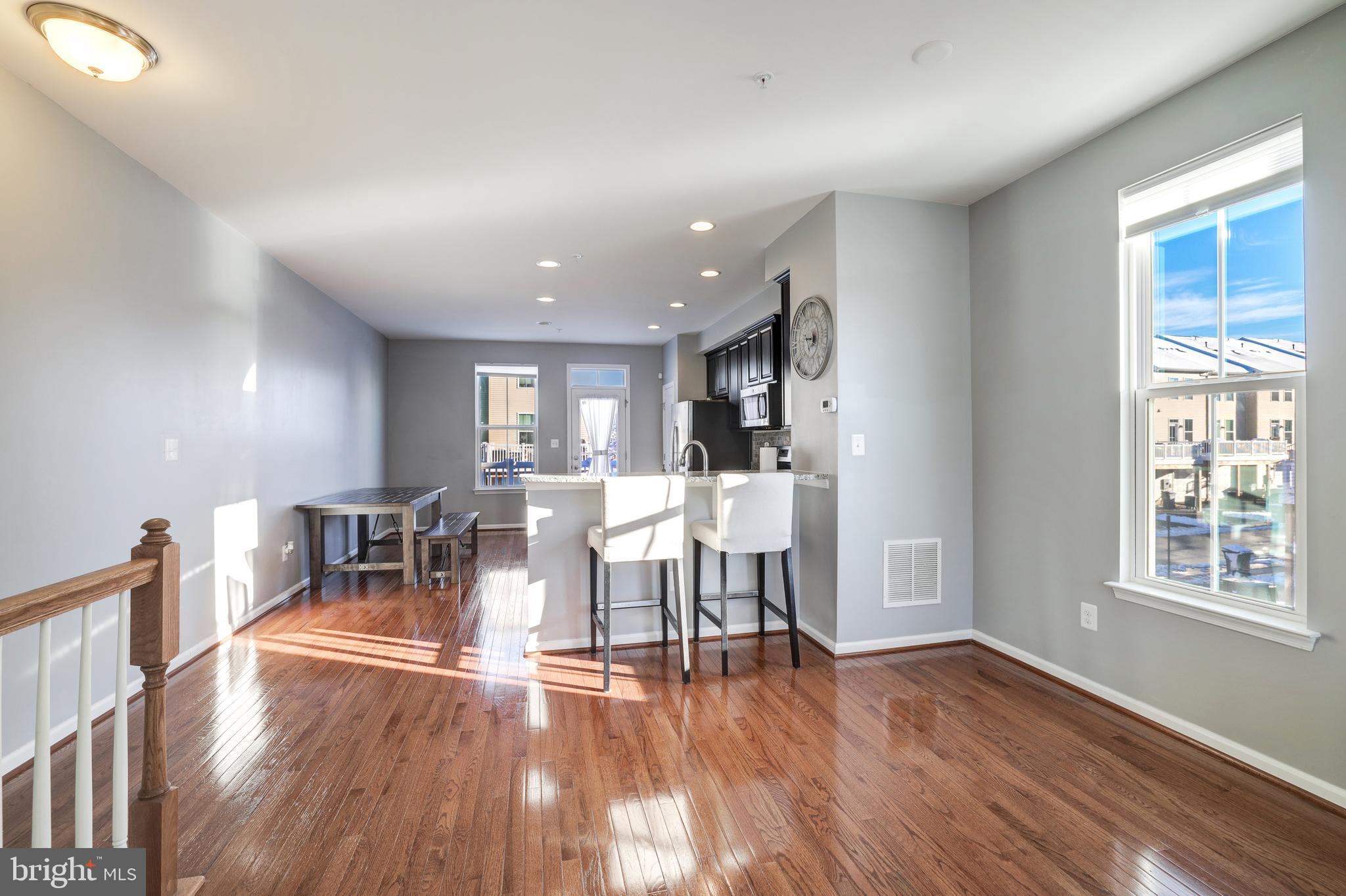 24845 Coats Square Aldie, VA 20105 - Photo 11 of 40 a view of a dining room with furniture window and wooden floor