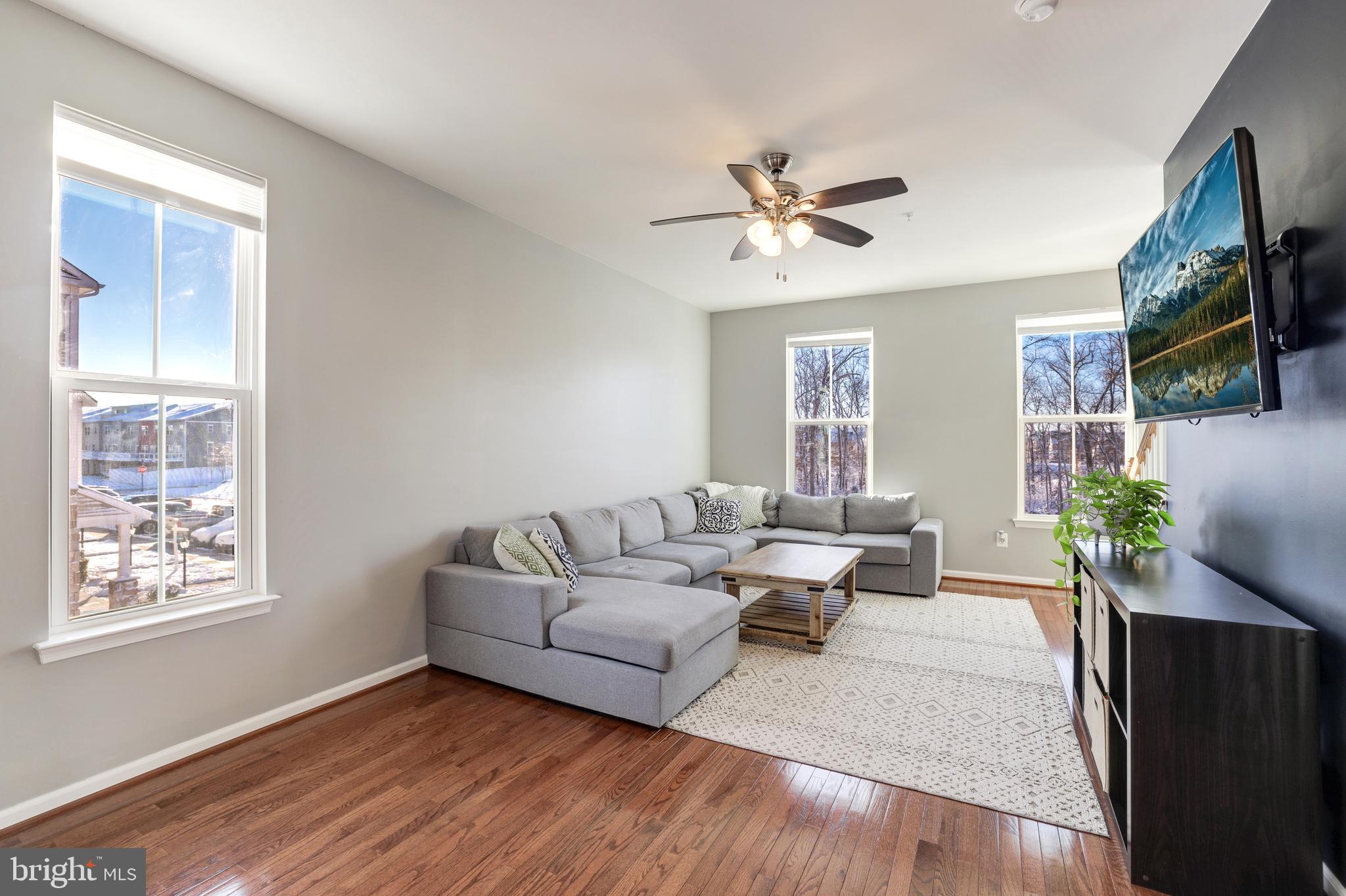 24845 Coats Square Aldie, VA 20105 - Photo 20 of 40 a living room with furniture wooden floor and a window
