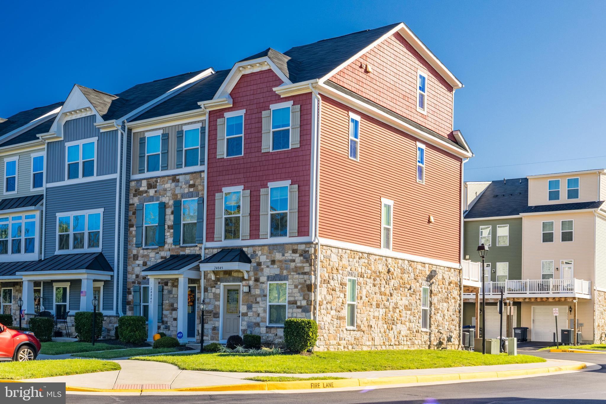24845 Coats Square Aldie, VA 20105 - Photo 2 of 40 a front view of a building with a swimming pool