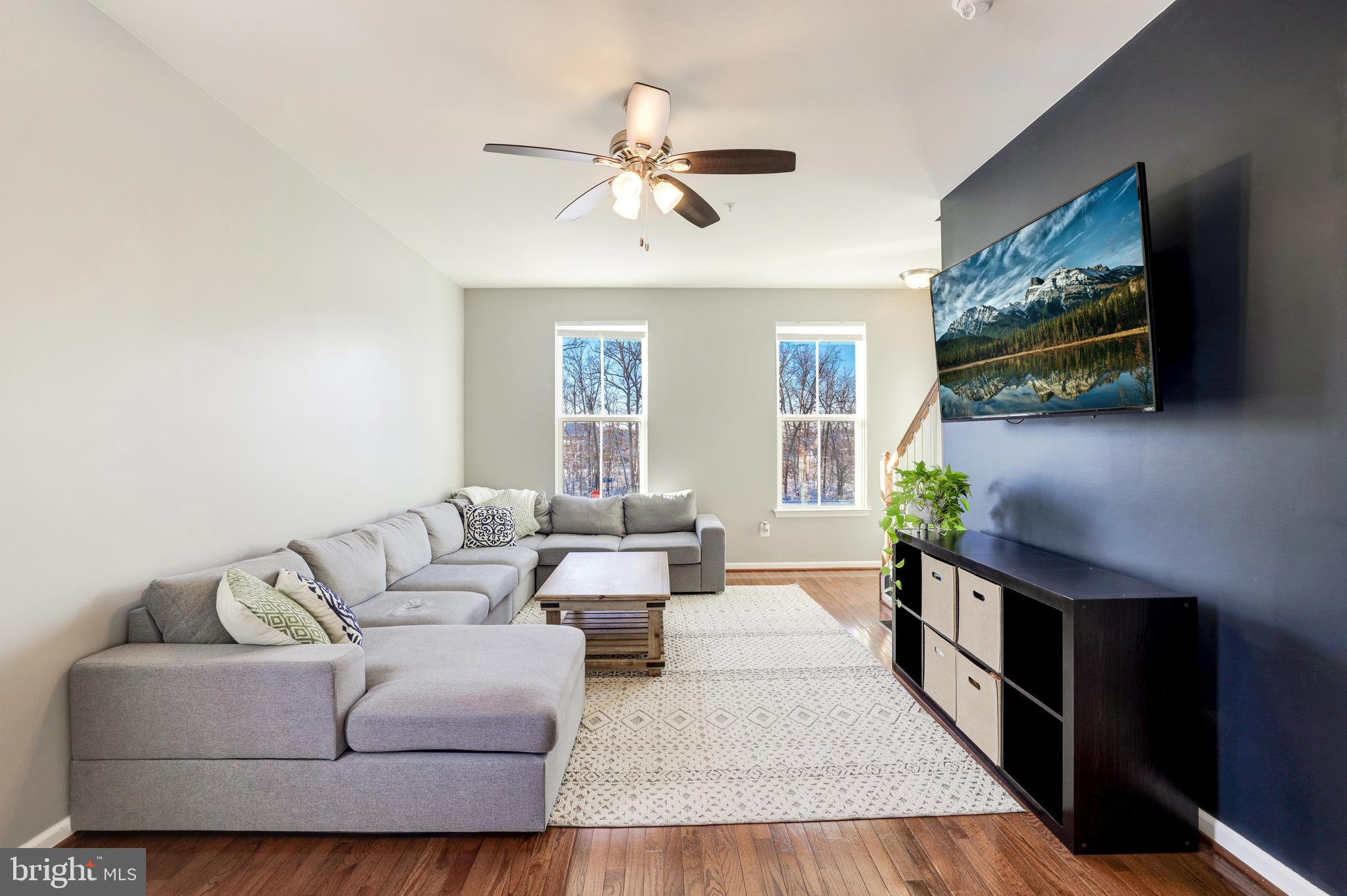 24845 Coats Square Aldie, VA 20105 - Photo 21 of 40 a living room with furniture and a flat screen tv