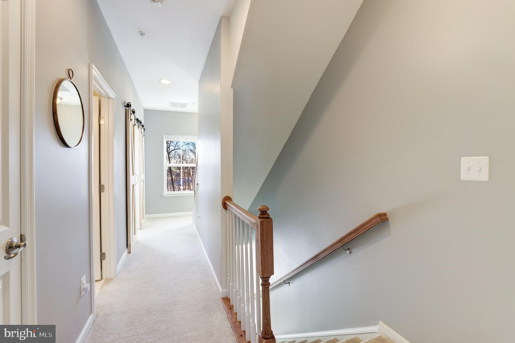 24845 Coats Square Aldie, VA 20105 - Photo 29 of 40 a view of a hallway with windows