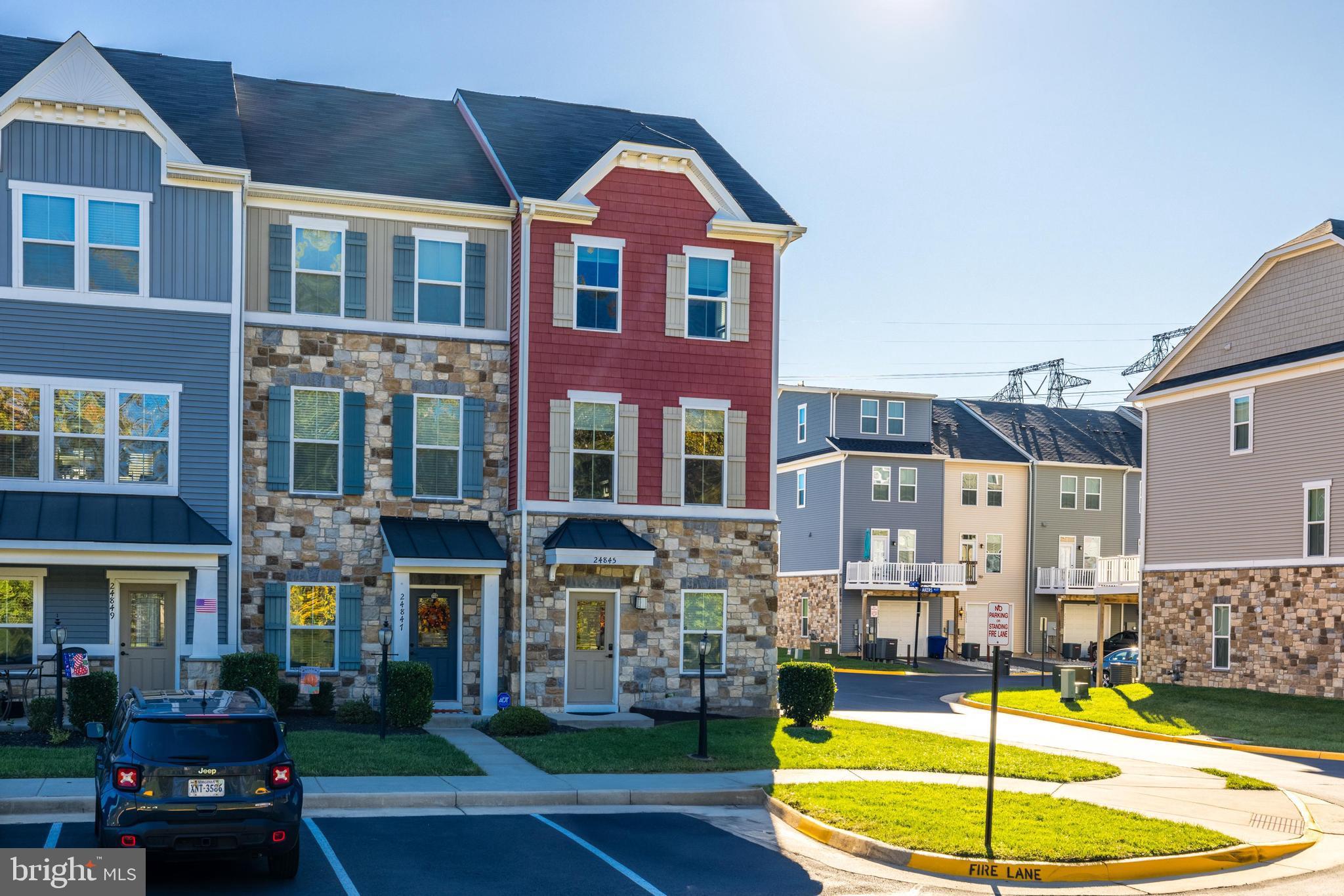 24845 Coats Square Aldie, VA 20105 - Photo 3 of 40 a view of a building with a swimming pool