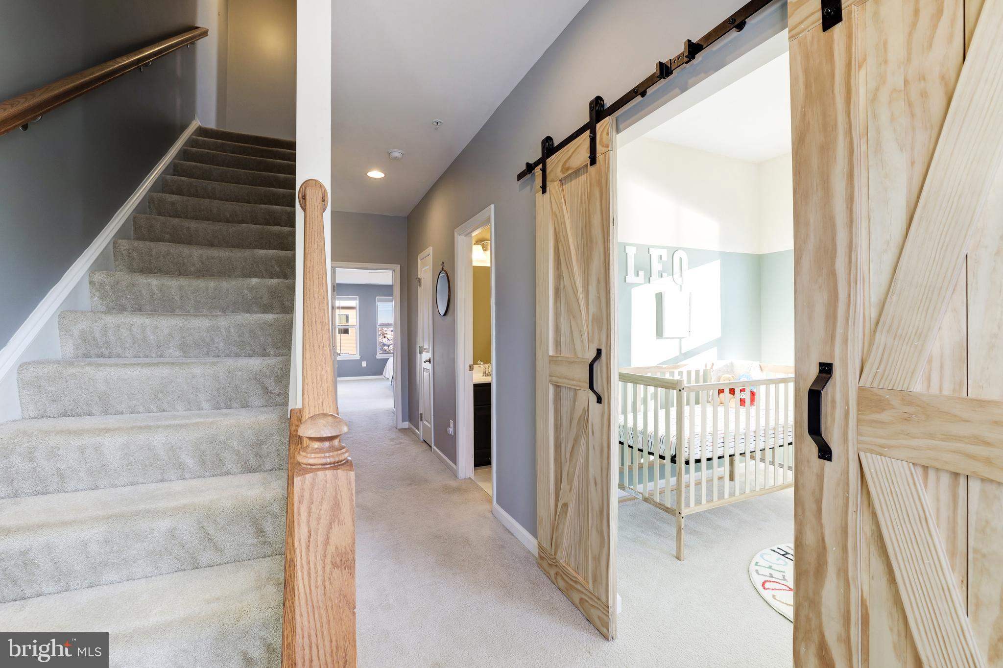 24845 Coats Square Aldie, VA 20105 - Photo 33 of 40 a view of a hallway with wooden floor and entryway