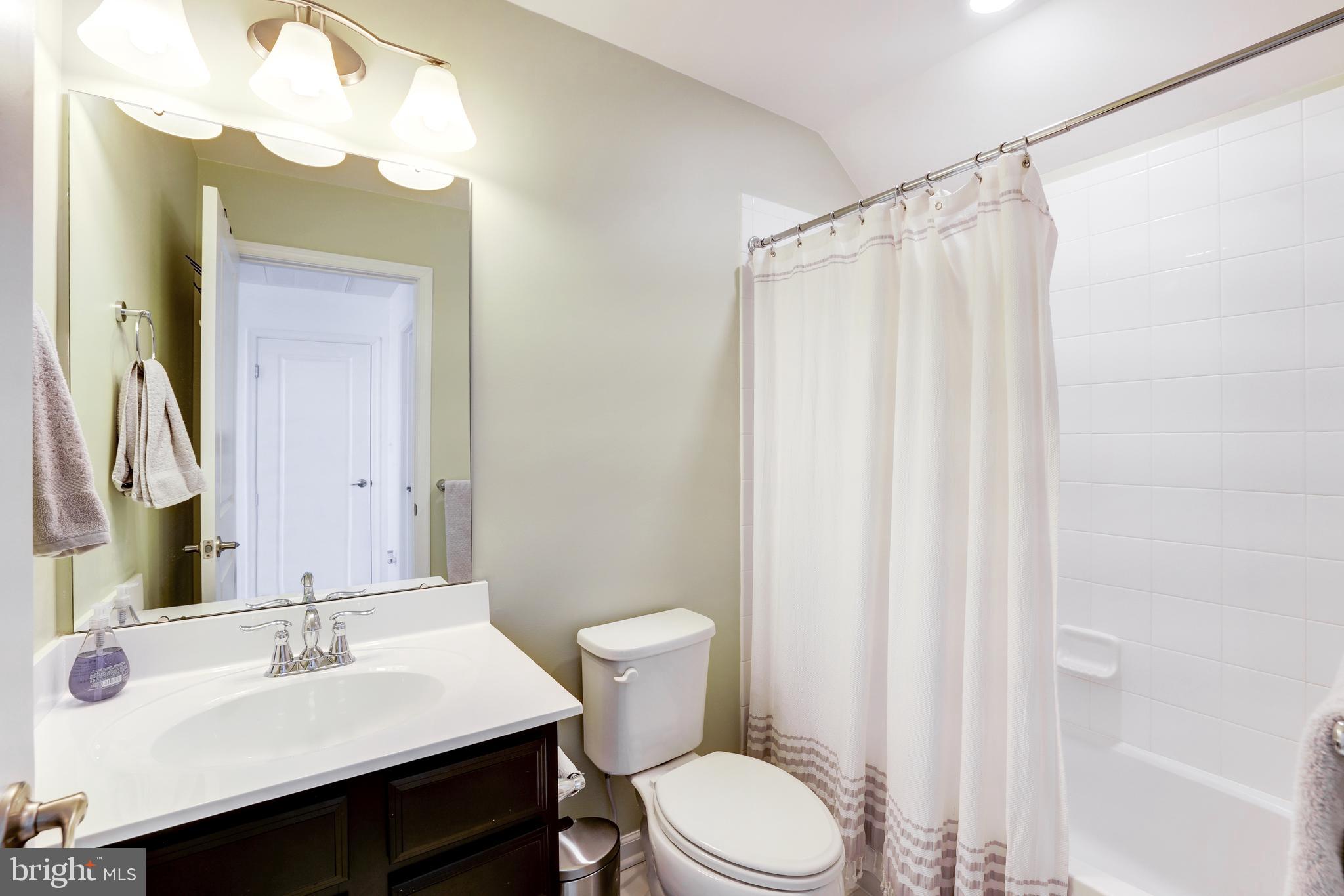 24845 Coats Square Aldie, VA 20105 - Photo 38 of 40 a bathroom with a sink vanity mirror and toilet