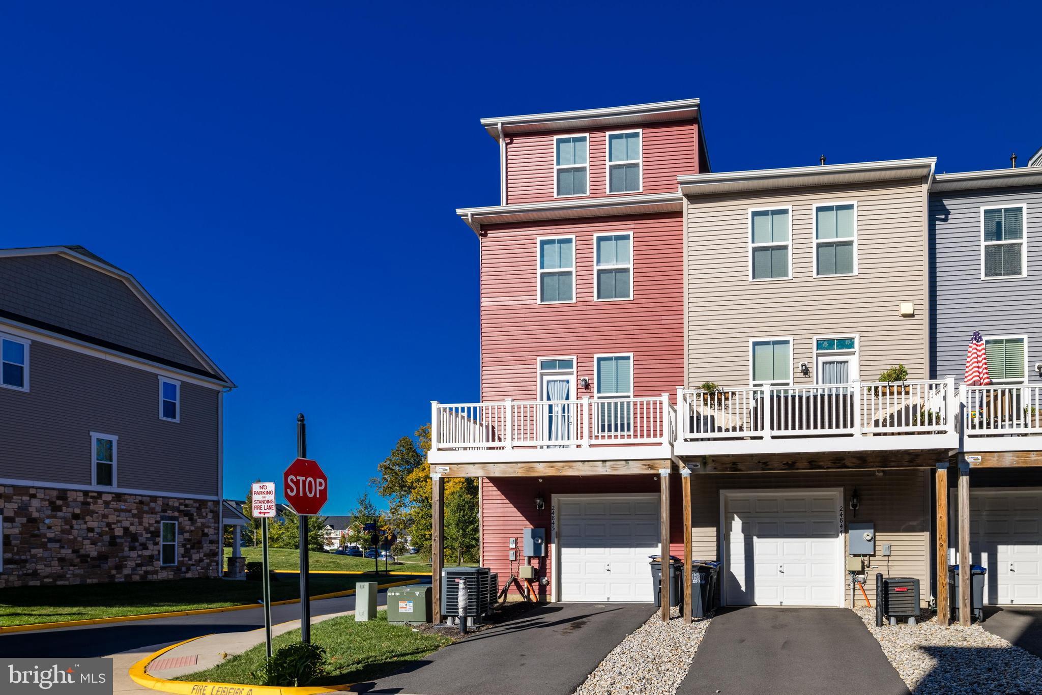 24845 Coats Square Aldie, VA 20105 - Photo 40 of 40 a front view of a house with swimming pool