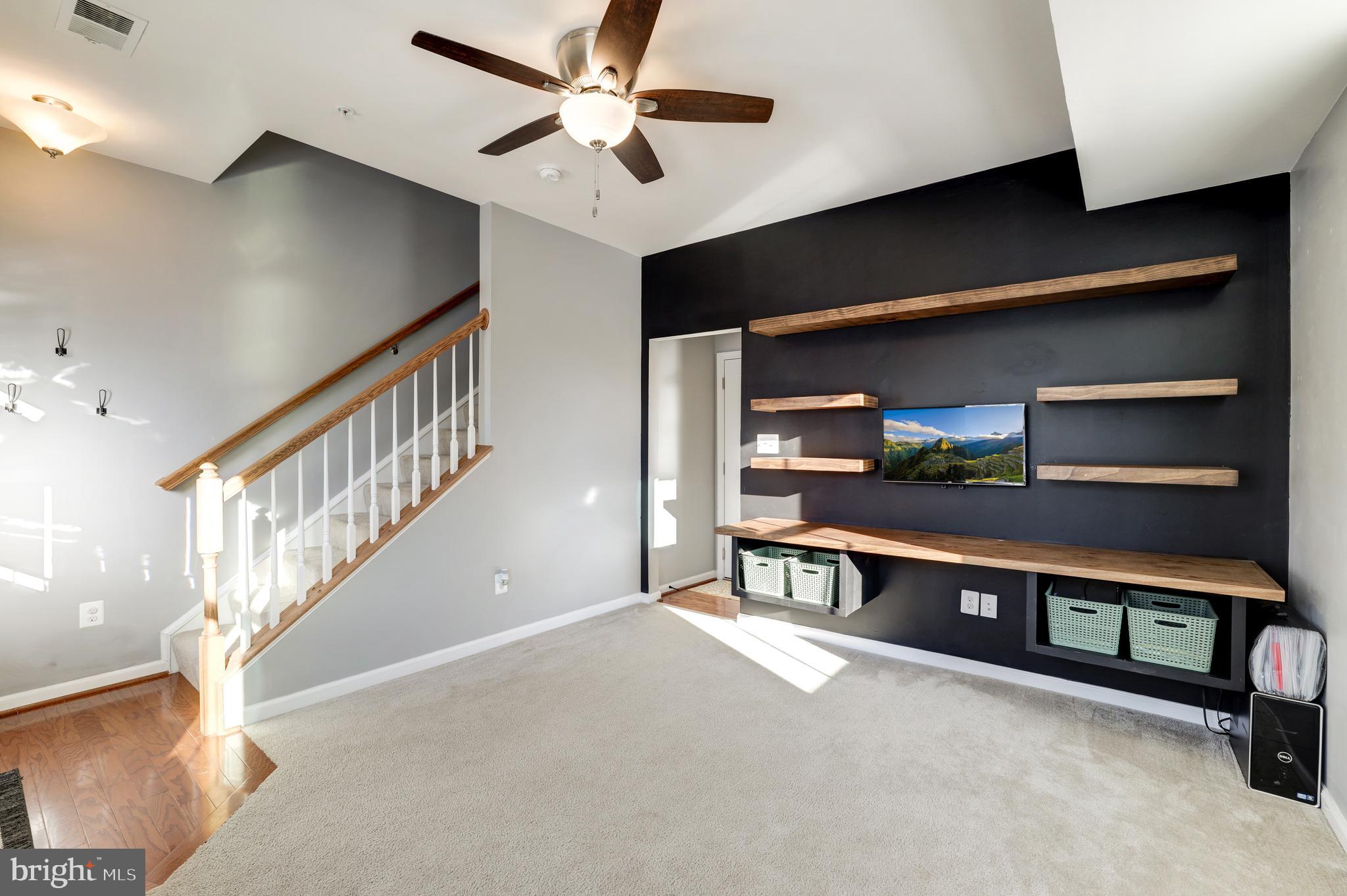 24845 Coats Square Aldie, VA 20105 - Photo 5 of 40 a view of a livingroom with furniture and a ceiling fan