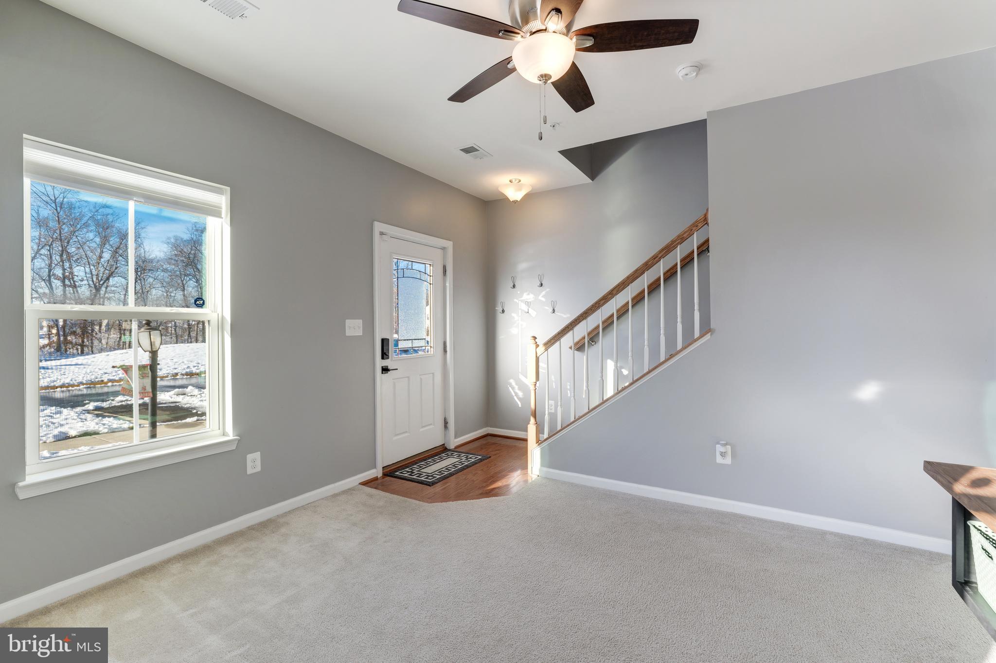 24845 Coats Square Aldie, VA 20105 - Photo 8 of 40 en view interior of a house with stairs and a ceiling fan