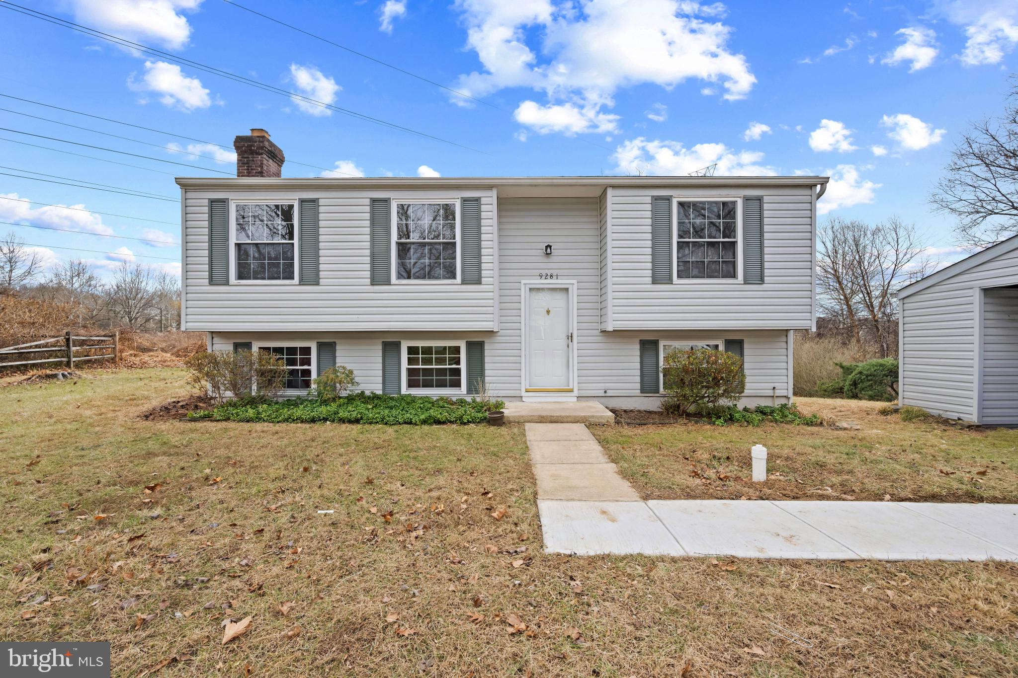 9281 Pigeon Wing Place Columbia, MD 21045 - Photo 1 of 55 a front view of a house with a yard