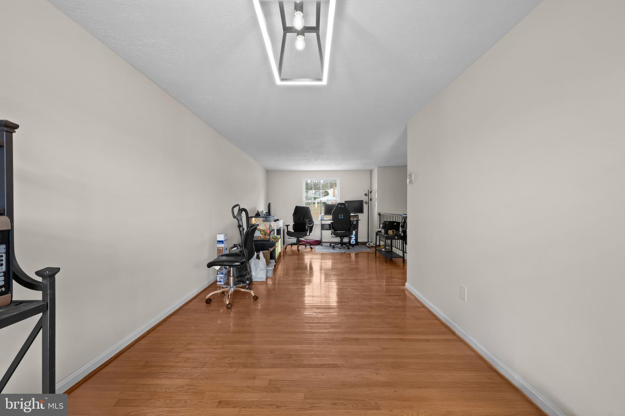 9281 Pigeon Wing Place Columbia, MD 21045 - Photo 13 of 55 a view of a room with wooden floor
