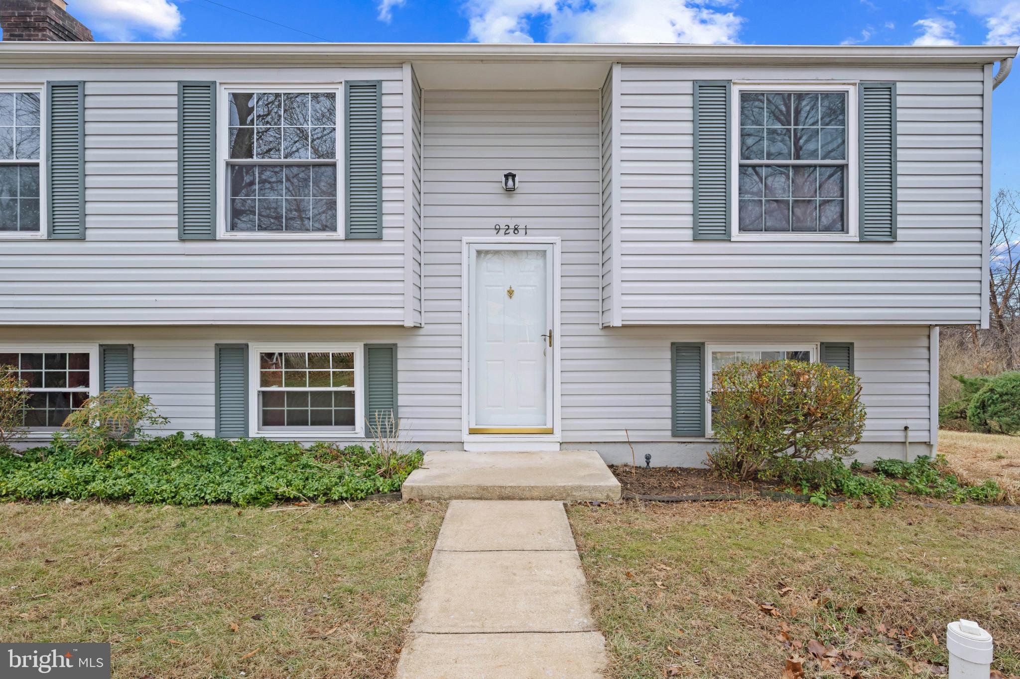 9281 Pigeon Wing Place Columbia, MD 21045 - Photo 2 of 55 a front view of a house with garden
